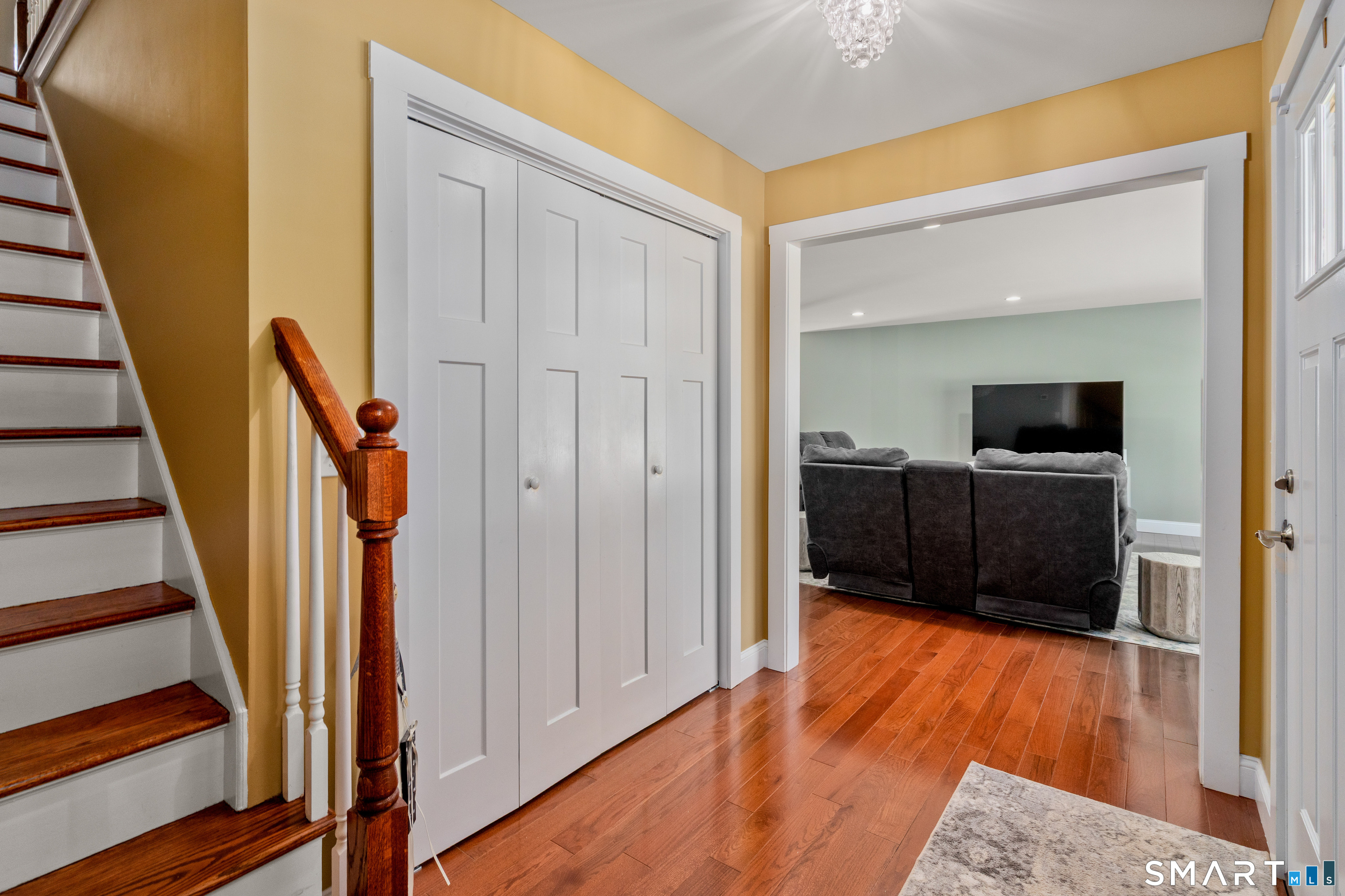 5 Limric Lane Suffield, CT 06078 - Photo 17 of 36 a view of a hallway with wooden floor and stairs