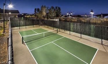 498 Pebble Run Avenue Henderson, NV 89011 - Photo 43 of 47 Serve and volley under twilight skies on this inviting sports court.