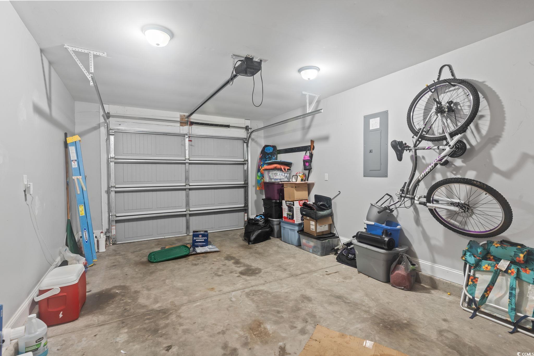 3630 Wayside Road Conway, SC 29527 - Photo 15 of 36 Garage featuring electric panel and a garage door
