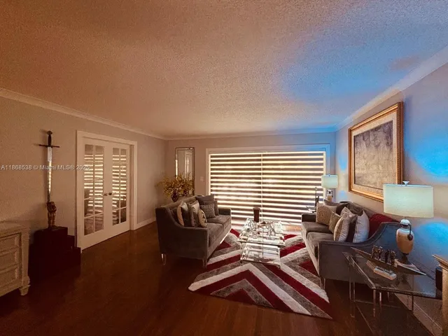 a bedroom with furniture and wooden floor