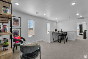 907 West Bright Ridge Ln Street, Unit 1430 St. George, UT 84790 - Photo 11 of 19 Open concept loft space with recessed lighting, carpet flooring, and multiple windows