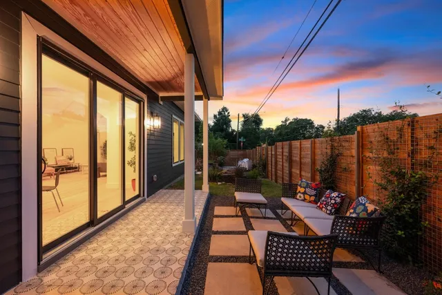 a view of balcony with furniture
