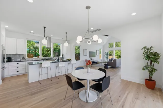a kitchen with a table and chairs in it