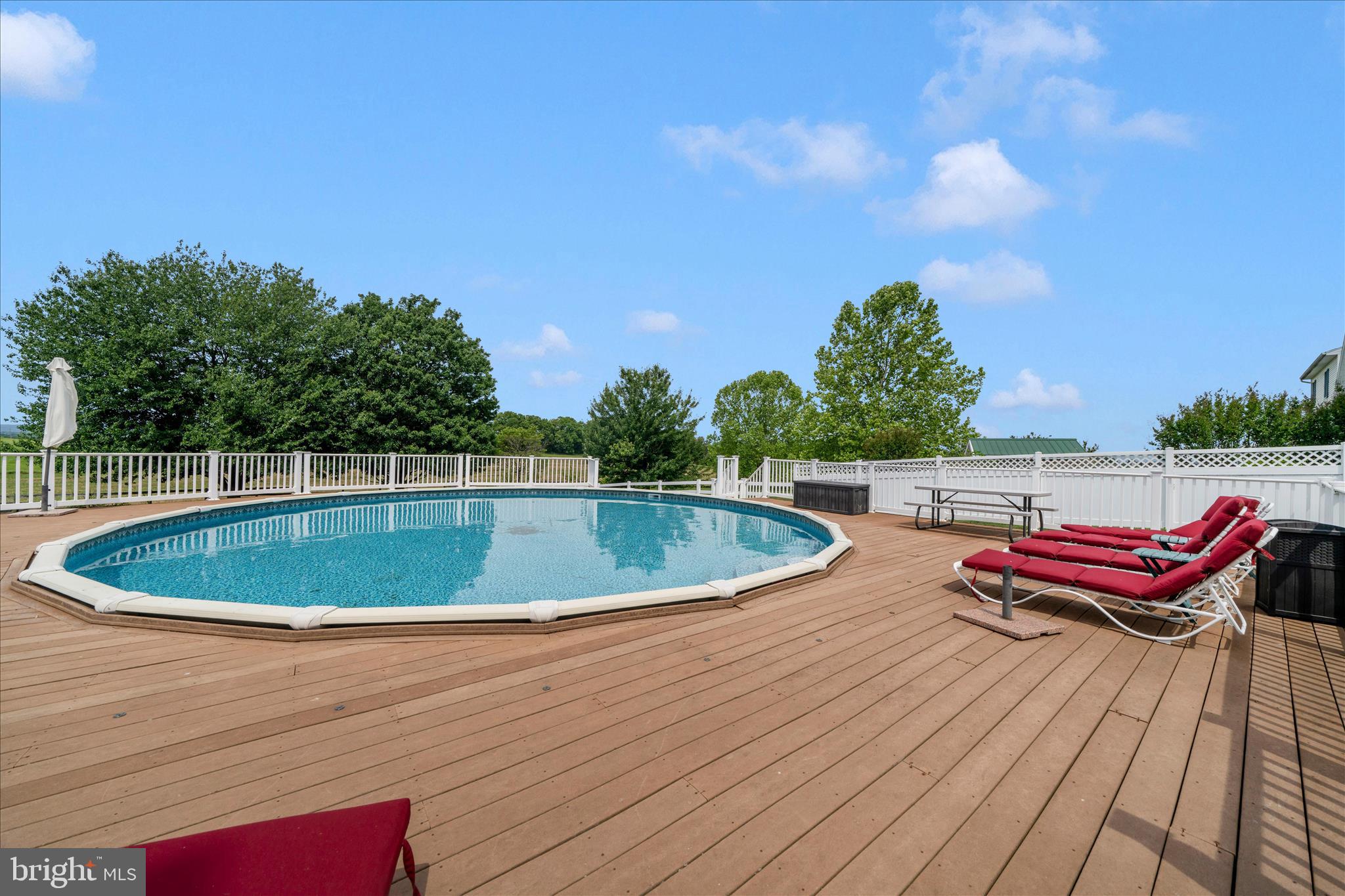 9534 Liberty Road Frederick, MD 21701 - Photo 49 of 70 a view of a swimming pool with a lounge chair