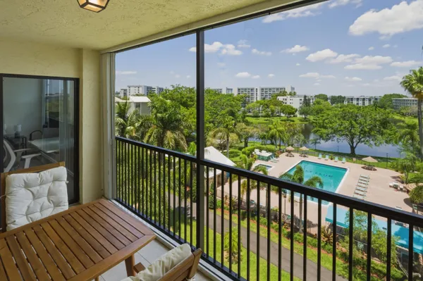 a view of a balcony with furniture