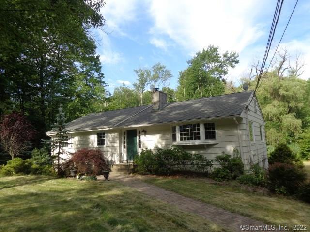 22 Taunton Ridge Road Newtown, CT 06470 - Photo 1 of 1 a view of a house with garden and trees