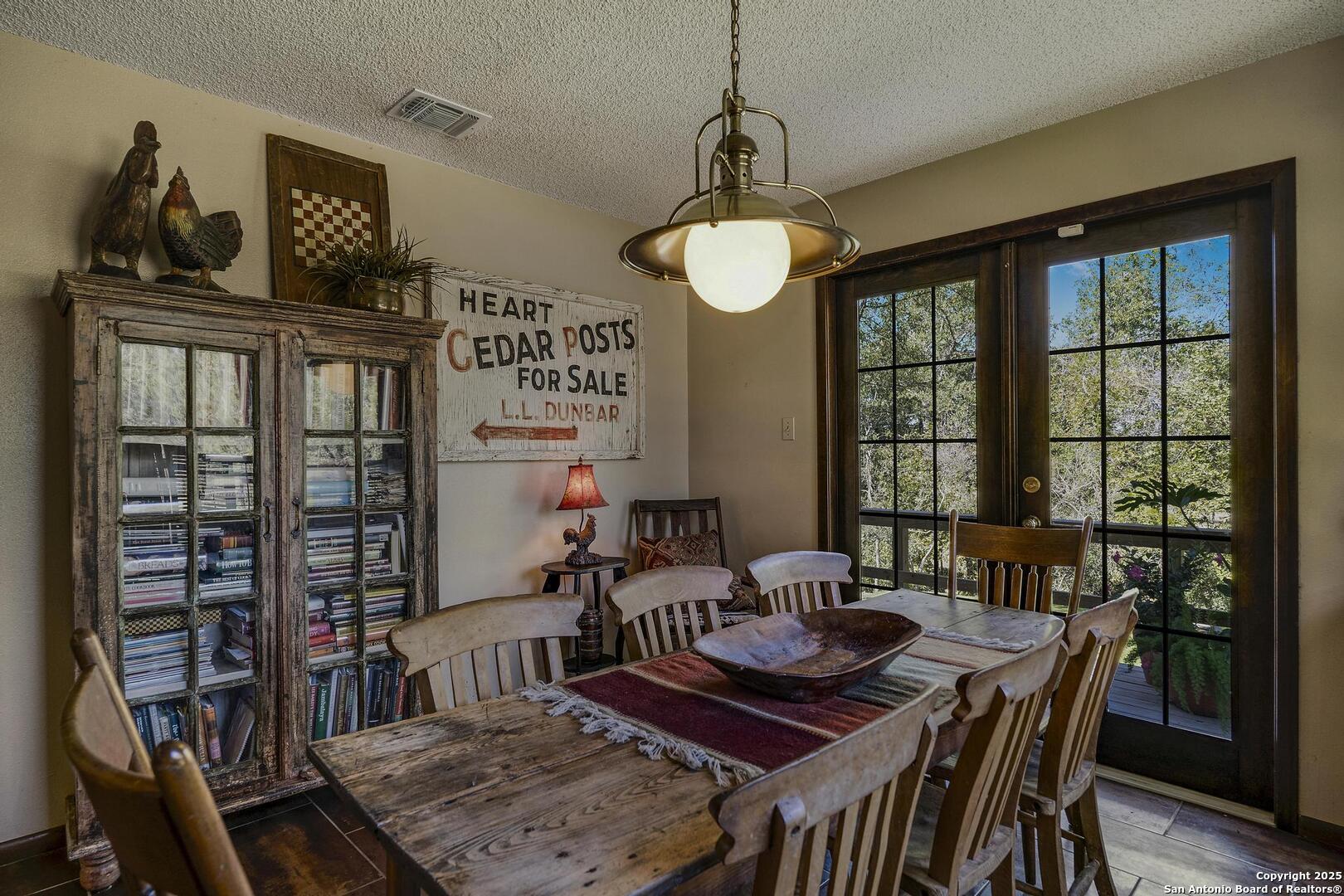 127 Siebeneicher Road Boerne, TX 78006 - Photo 16 of 50 a view of a dining room with furniture window and outside view
