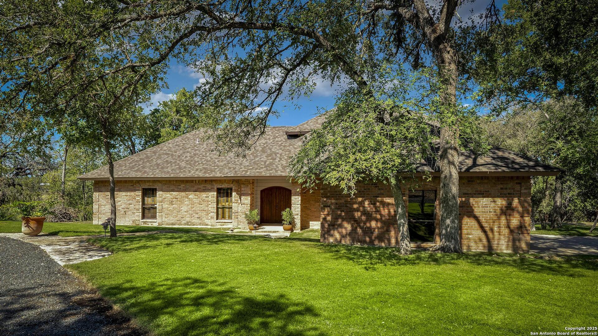 127 Siebeneicher Road Boerne, TX 78006 - Photo 3 of 50 a front view of a house with a garden