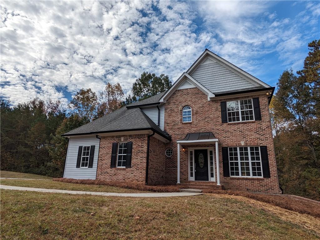 6877 Tyree Road Winston, GA 30187 - Photo 1 of 1 a front view of a house with a garden