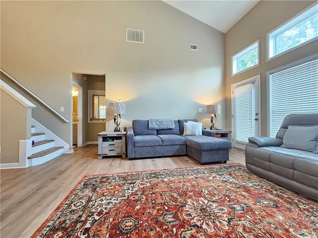 a living room with furniture and a rug