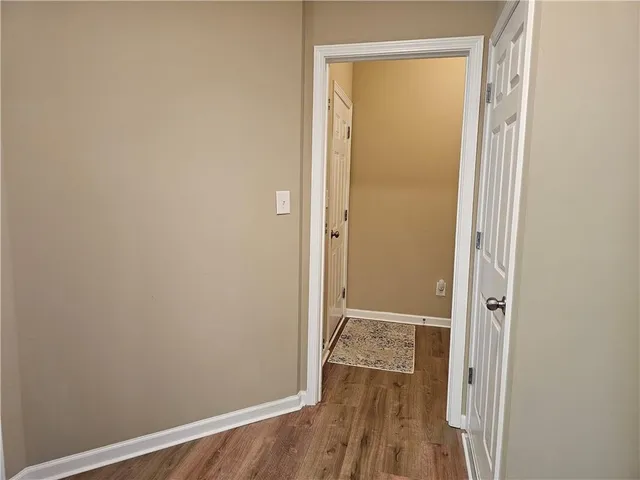 a view of a small space with wooden floor