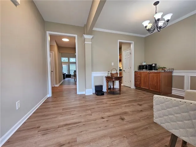 a view of a livingroom with furniture nad wooden floor