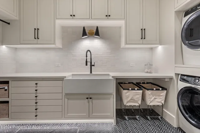 a bedroom with bed and cabinets