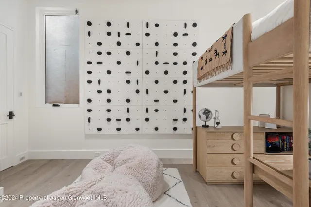 a bedroom with a cabinets and walk in closet