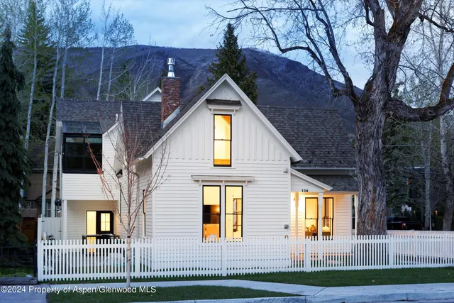 a view of a house with large windows