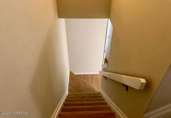 a view of balcony with wooden floor