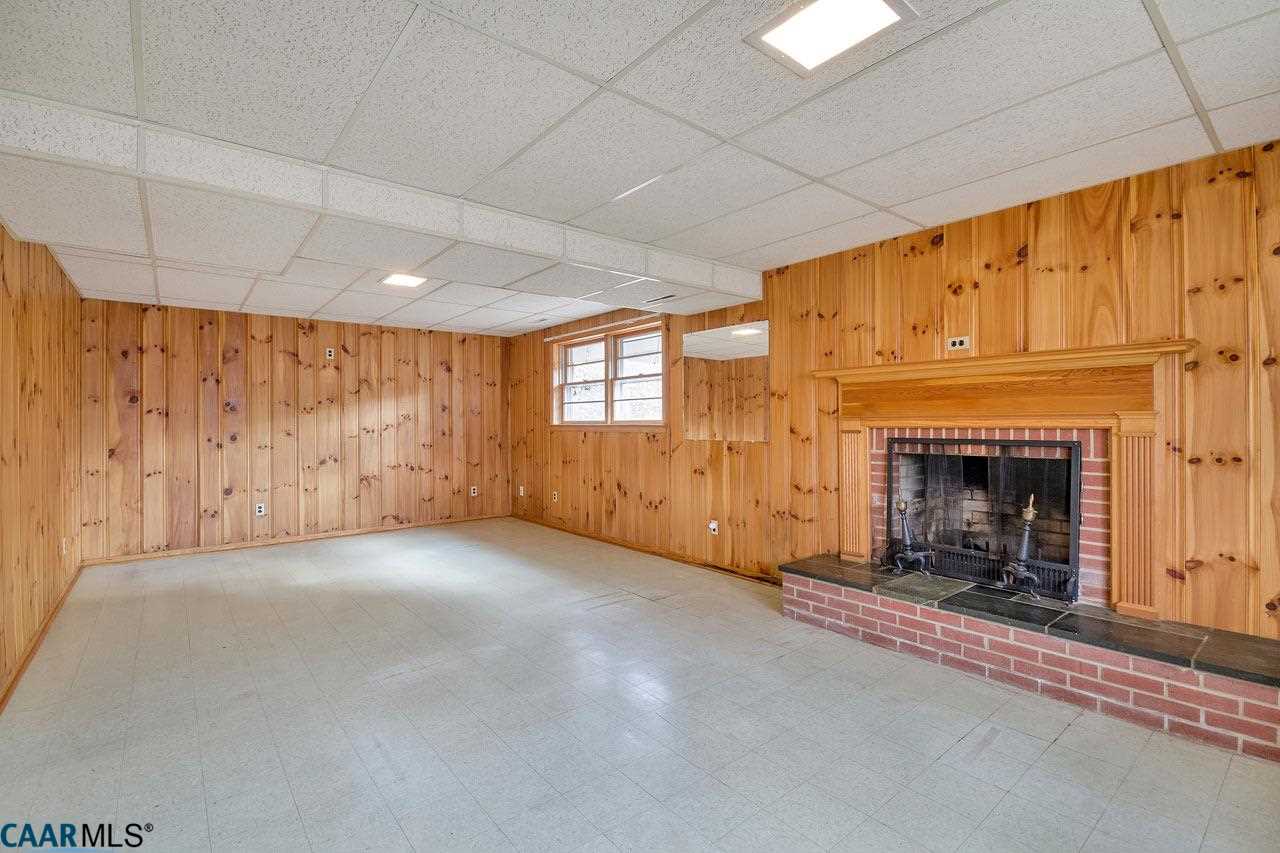 706 McIntire Road Charlottesville, VA 22902 - Photo 13 of 25 Large rec room in the basement with plenty of windows and ANOTHER wood-burning fireplace.