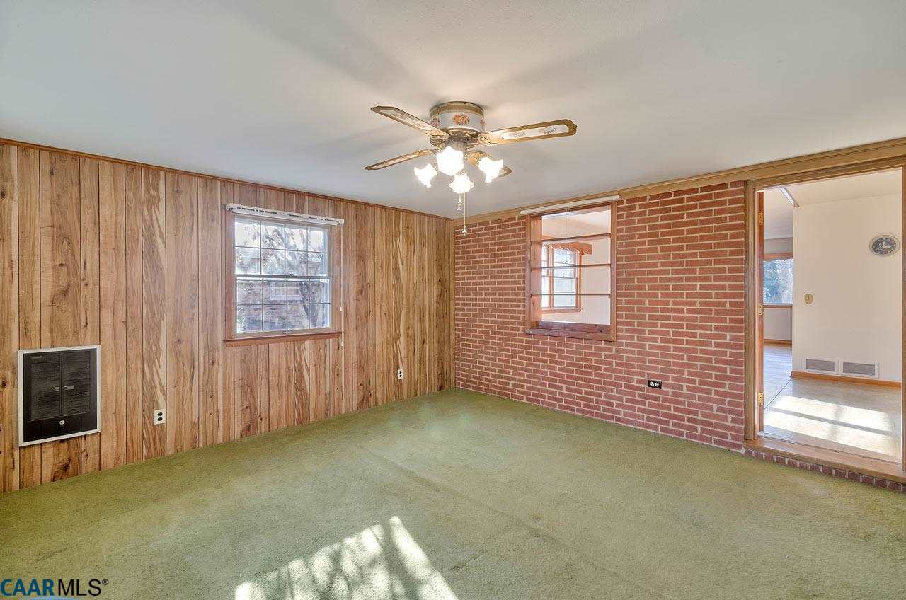 706 McIntire Road Charlottesville, VA 22902 - Photo 7 of 25 The original brick exterior wall adds character to the family room.