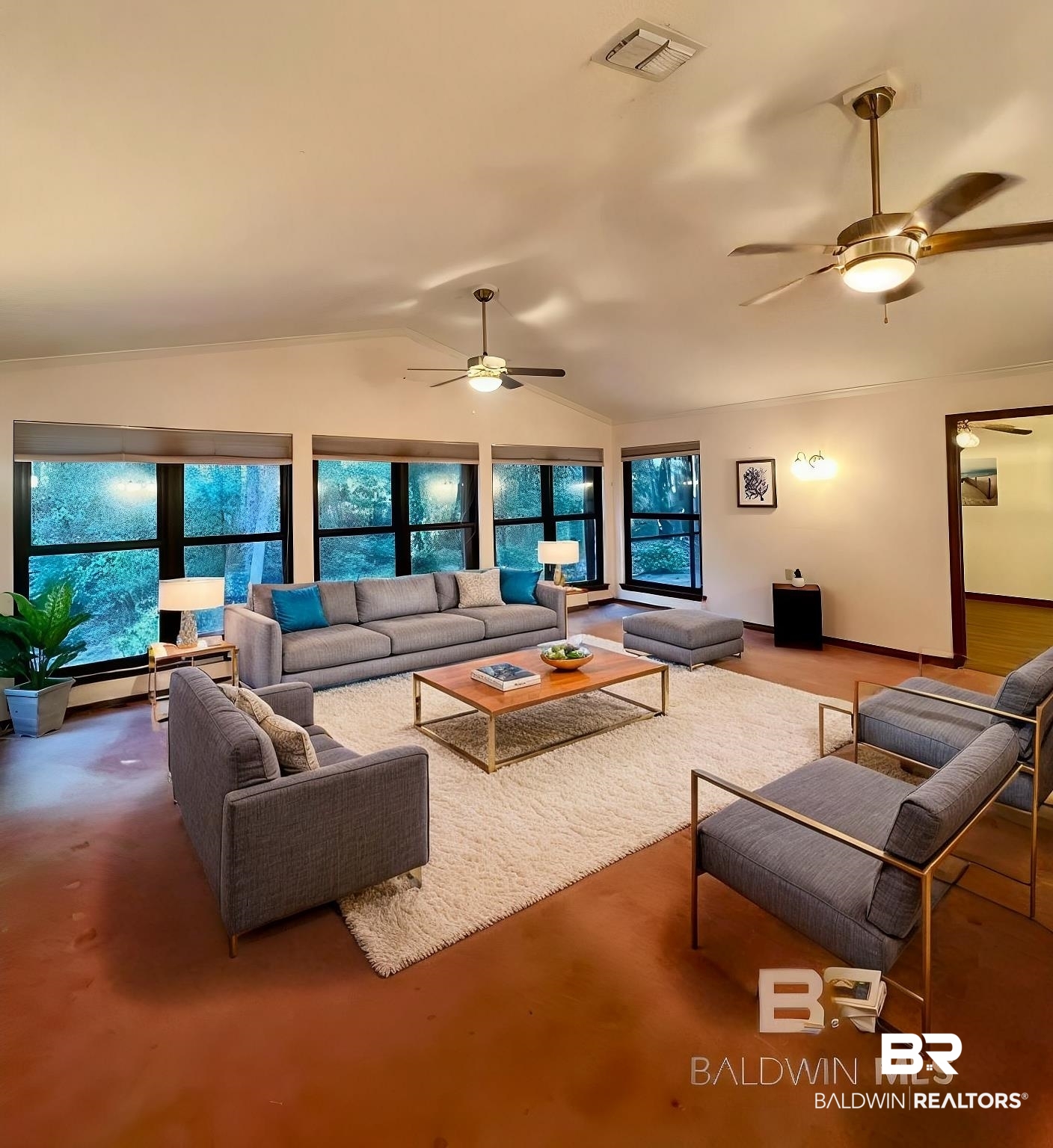 2682 Pine Ridge Drive Lillian, AL 36549 - Photo 6 of 37 Living room with a baseboard radiator, vaulted ceiling, and ceiling fan