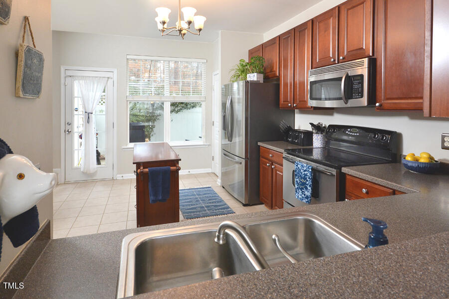 4847 Sir Duncan Way Raleigh, NC 27612 - Photo 8 of 29 4847 Sir Duncan Kitchen from Dining Area