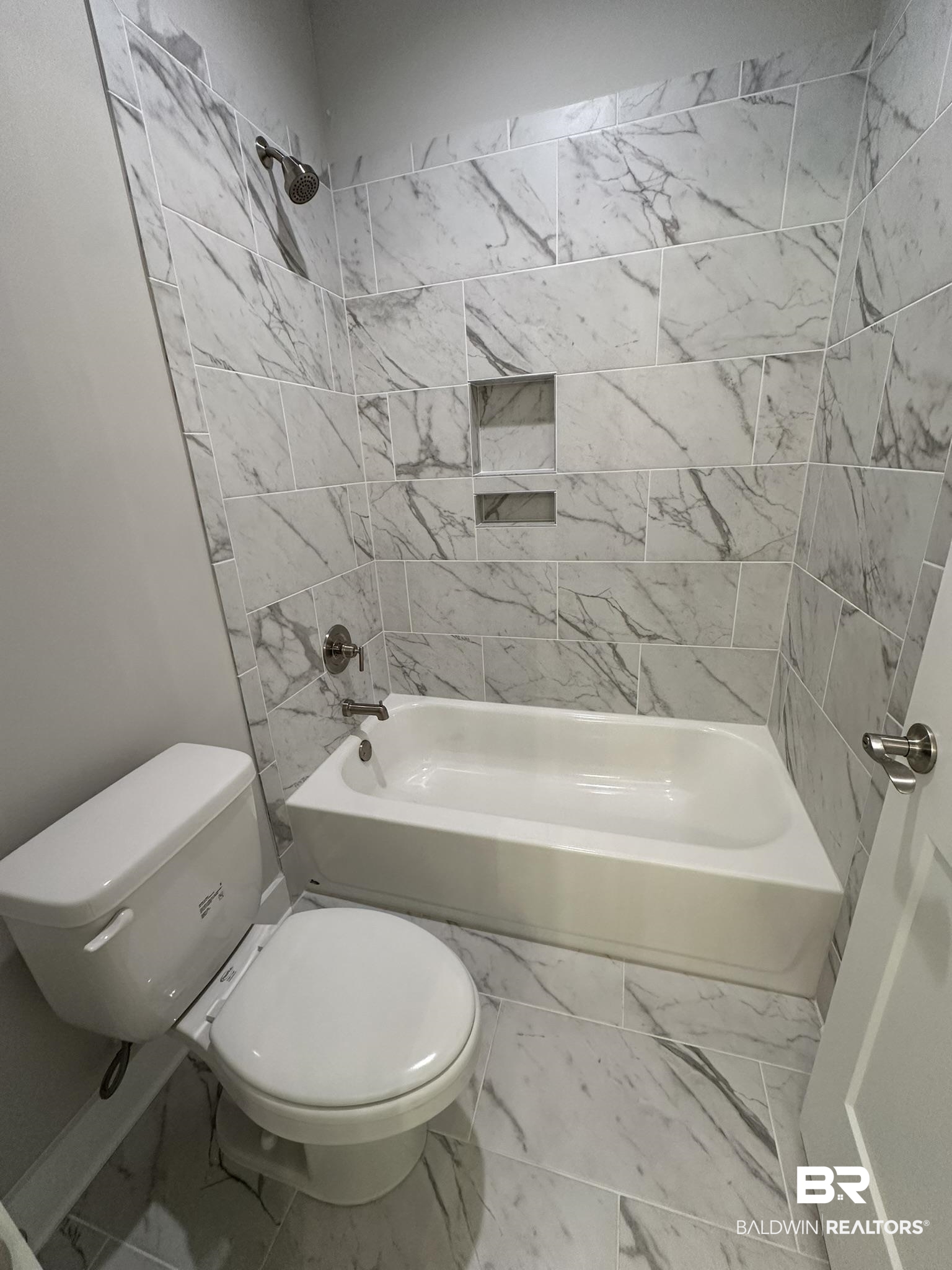 23582 Travis Stock Street, Unit 48 Foley, AL 36535 - Photo 23 of 51 Bathroom featuring tiled shower / bath combo and toilet