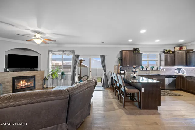 a living room with a flat screen tv and a fireplace