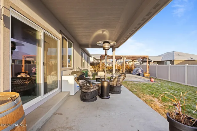 a view of a patio with couches chairs and potted plants