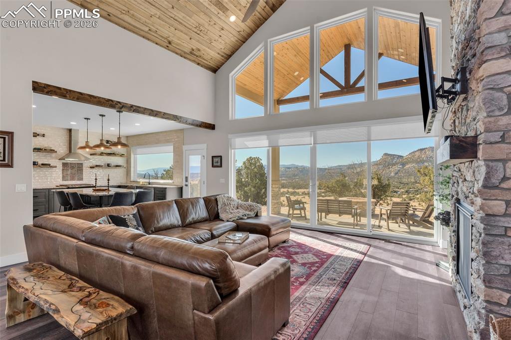 228 Freek Ranch Road Canon City, CO 81212 - Photo 13 of 50 a living room with furniture and a floor to ceiling window