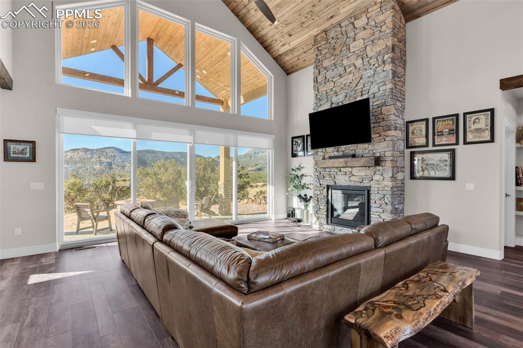 228 Freek Ranch Road Canon City, CO 81212 - Photo 14 of 50 a living room with furniture a flat screen tv and a fireplace