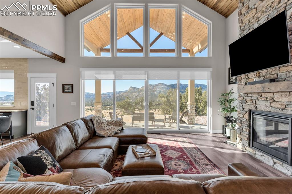 228 Freek Ranch Road Canon City, CO 81212 - Photo 15 of 50 a living room with furniture a flat screen tv and a fireplace