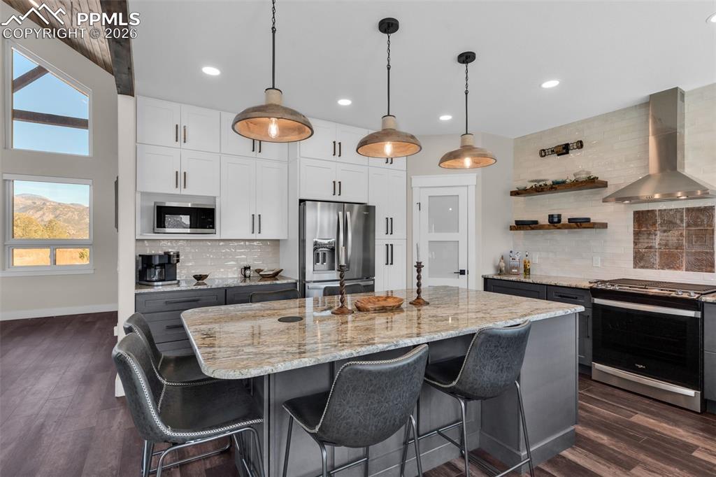 228 Freek Ranch Road Canon City, CO 81212 - Photo 23 of 50 a large kitchen with a table and chairs
