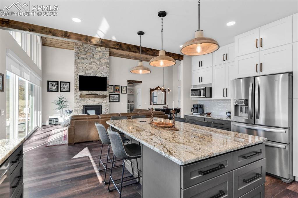 228 Freek Ranch Road Canon City, CO 81212 - Photo 26 of 50 a kitchen with stainless steel appliances granite countertop a stove oven and a refrigerator