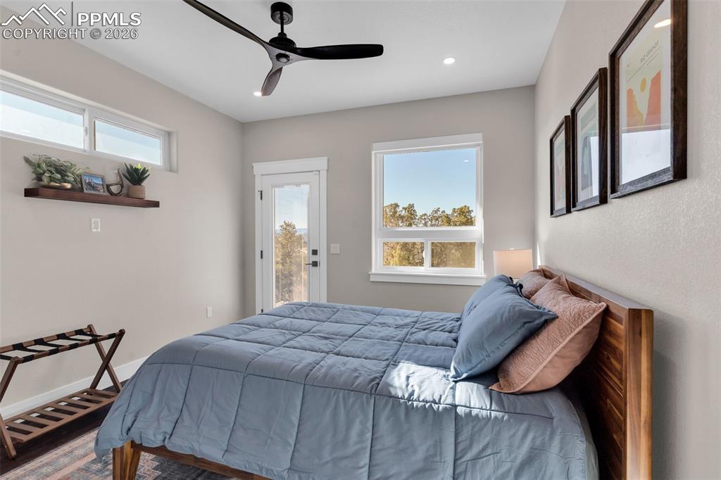 228 Freek Ranch Road Canon City, CO 81212 - Photo 39 of 50 a bed sitting in a bedroom next to a window