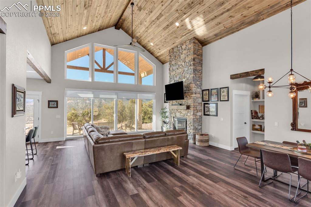 228 Freek Ranch Road Canon City, CO 81212 - Photo 8 of 50 a living room with furniture a fireplace and a flat screen tv