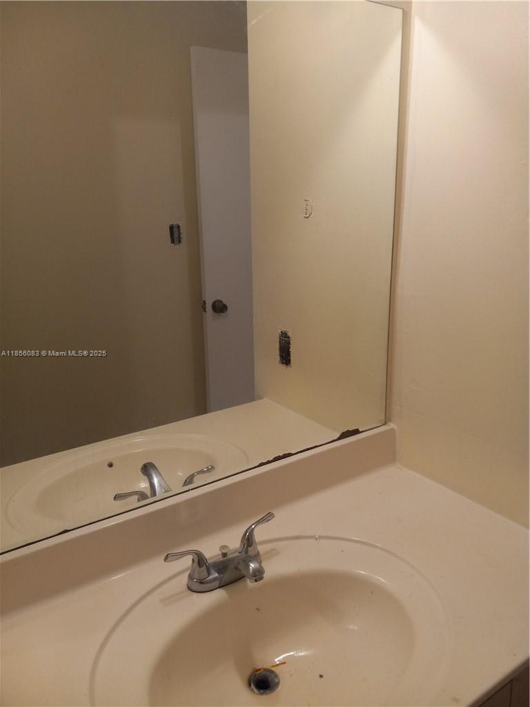 Lakeshore at University Park Miramar, FL 33025 - Photo 2 of 15 a bathroom with a sink and a mirror
