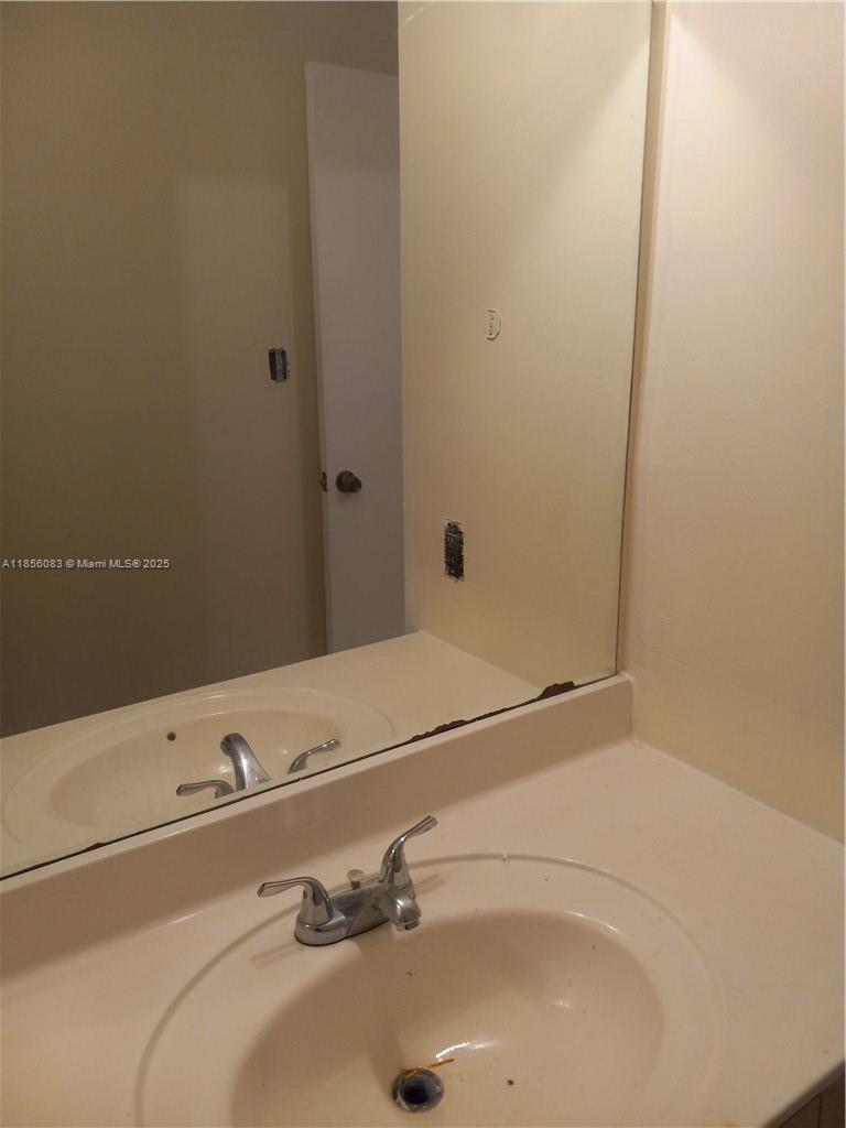 Lakeshore at University Park Miramar, FL 33025 - Photo 5 of 15 a bathroom with a sink and a mirror