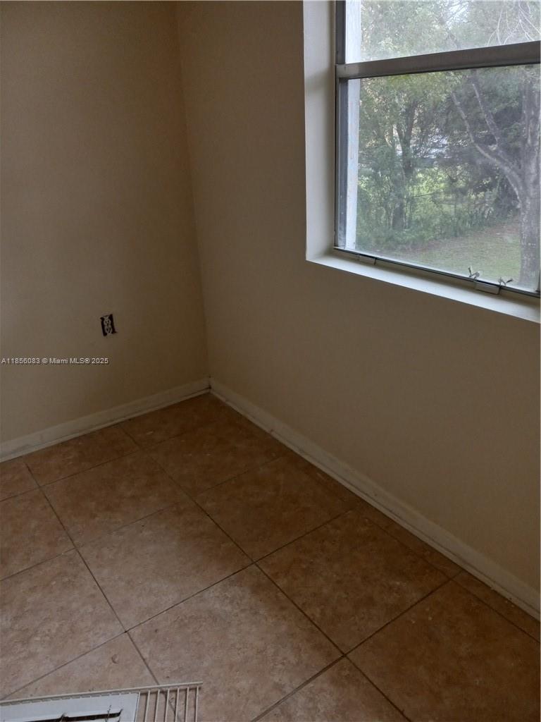Lakeshore at University Park Miramar, FL 33025 - Photo 6 of 15 a view of a small space with wooden floor and a window