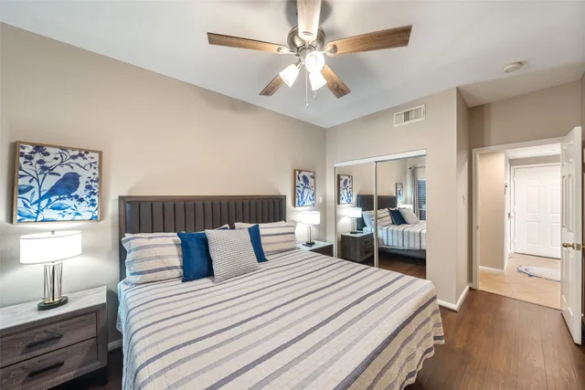 a bedroom with bed and a chandelier