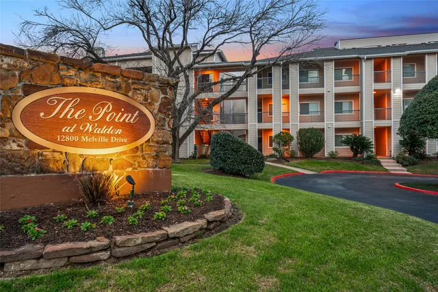 a view of a building with a yard