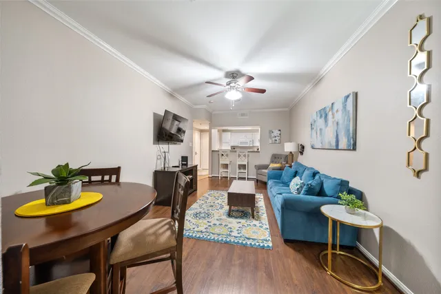 a view of a dining room with furniture and wooden floor