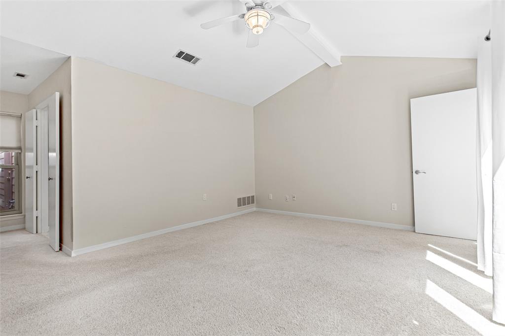 6807 Anglebluff Circle Dallas, TX 75248 - Photo 20 of 28 an empty room with a ceiling fan and a window