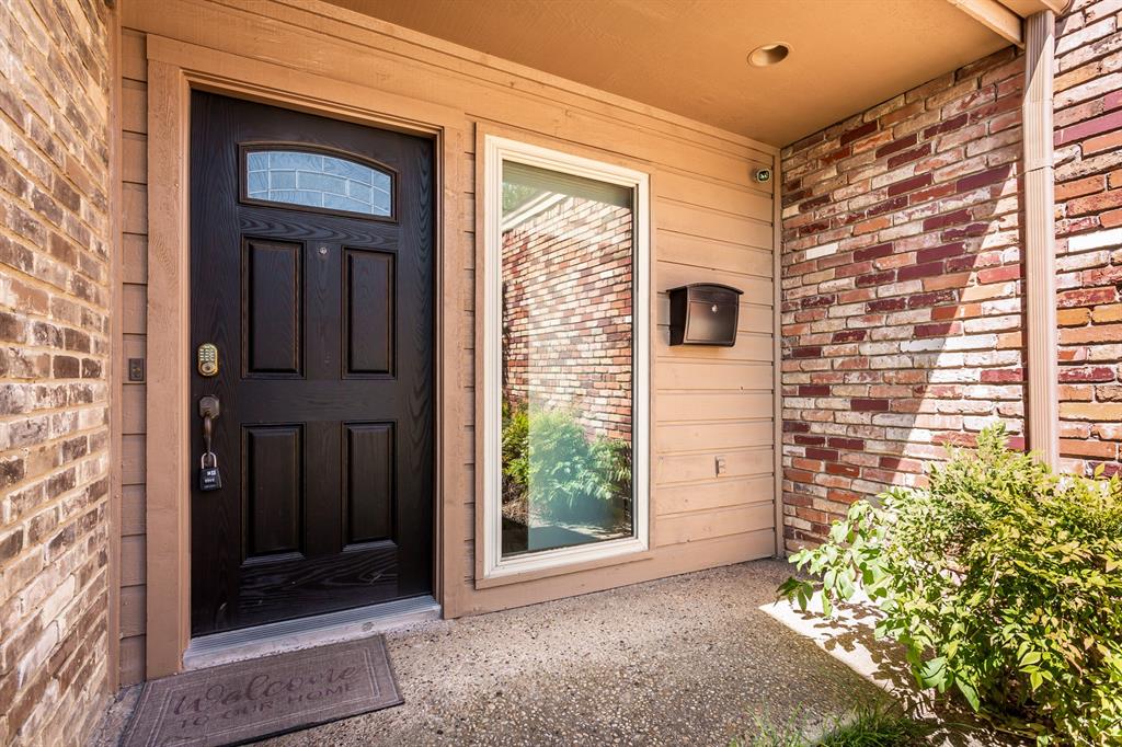 6807 Anglebluff Circle Dallas, TX 75248 - Photo 2 of 28 a front view of a house with a yard