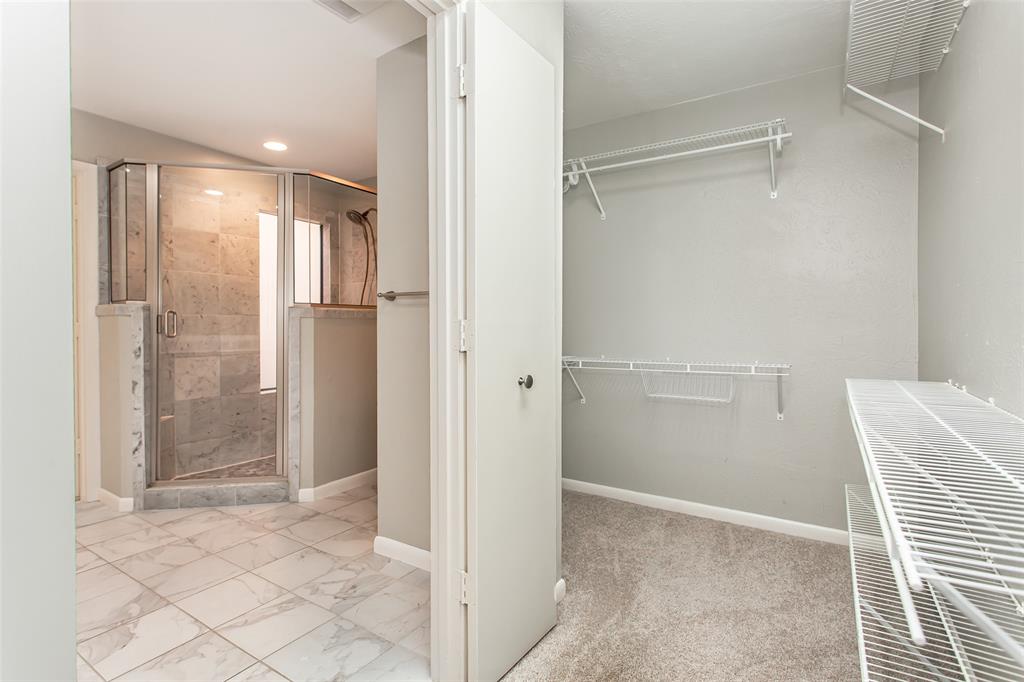 6807 Anglebluff Circle Dallas, TX 75248 - Photo 24 of 28 a bathroom with a shower and closet