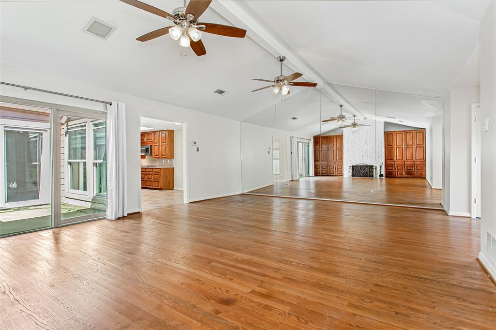 6807 Anglebluff Circle Dallas, TX 75248 - Photo 8 of 28 wooden floor in an empty room with a window