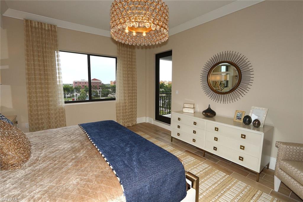 1135 3rd Avenue South, Unit 517 Naples, FL 34102 - Photo 12 of 35 a bedroom with a bed and a window