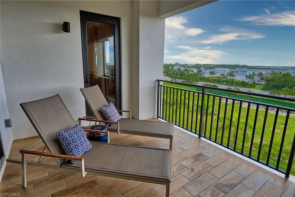 a view of balcony with furniture