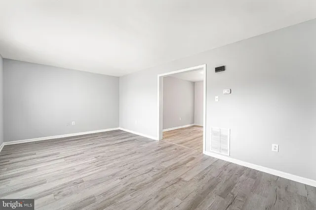a kitchen with granite countertop a stove and a sink