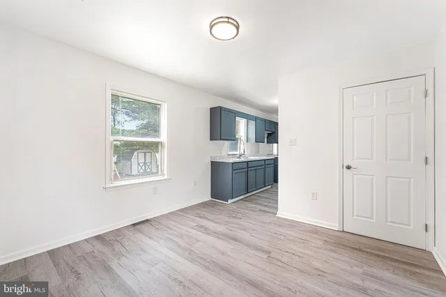 a kitchen with a stove and a refrigerator
