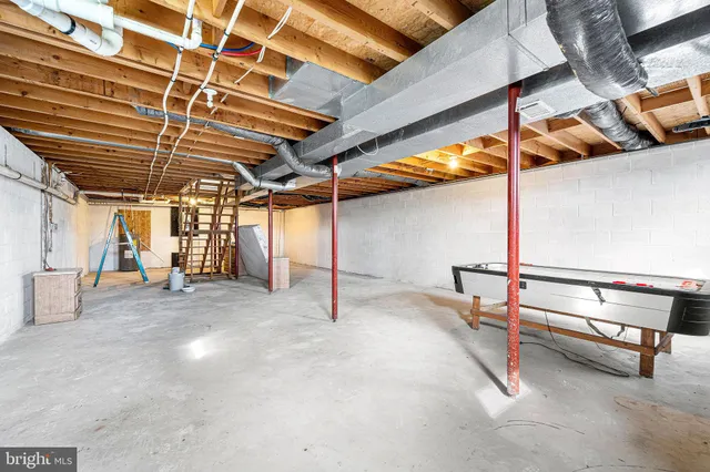 a bathroom with a sink a toilet and shower curtain