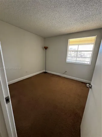 a kitchen that has a sink and a stove